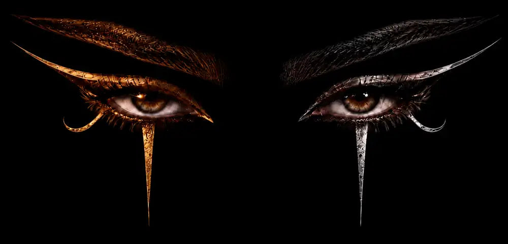 Two eyes in the dark, one marked in gold, one in silver